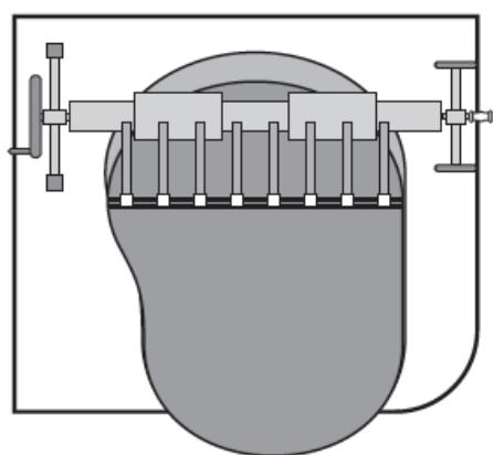 Diagram of a mechanical device with a central component and two vertical supports, enclosed in a rectangular frame (no text or symbols)