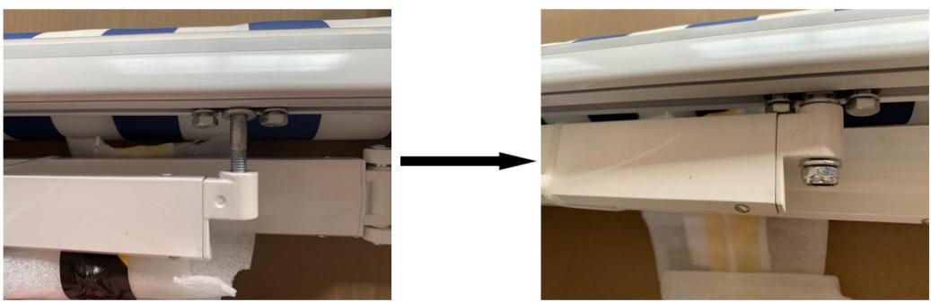 Close-up of a white plastic panel with blue and white stripes being adjusted, showing structural components (no text or symbols visible)