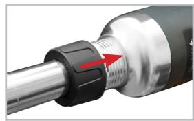 Close-up of a mechanical component with a red arrow indicating a specific feature (no text or symbols visible)