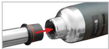 Close-up of a mechanical component with a red arrow pointing to a threaded end (no visible text or symbols)