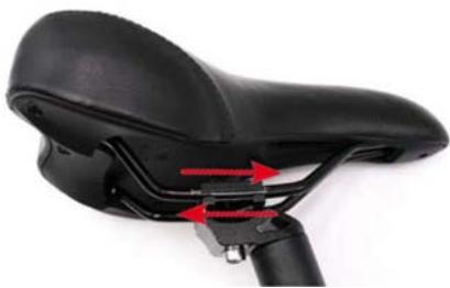 Close-up of a black bicycle seat with red directional arrows indicating motion or movement (no text or symbols)