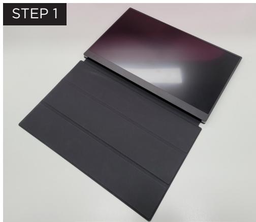 Two black rectangular panels with reflective surfaces, one tilted and one tilted, labeled 'STEP 1' in top-left corner (no other text or symbols)