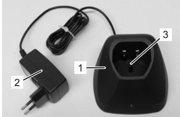 Close-up of a black electrical plug, power cord, and charging socket with labeled parts (no text or symbols on main subject)