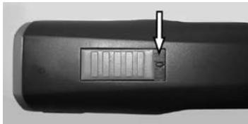 Close-up of a black remote control device with a small rectangular display and an arrow pointing to it (no visible text or symbols)