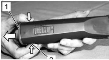 Close-up of a handheld device with numbered labels pointing to features, likely for labeling or testing purposes.