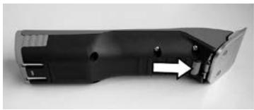 Close-up of a black electronic device with a white arrow pointing to a component (no visible text or symbols)
