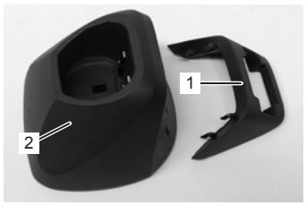 Black plastic mechanical component with labeled parts (1 and 2), no visible text or symbols beyond labels