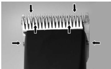 Close-up of a mechanical component with spiked tip and directional arrows indicating force or movement (no text or symbols)