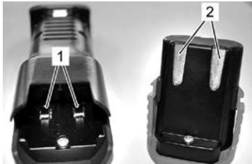 Close-up of two black automotive electrical connectors with labeled parts (1 and 2), no visible text or symbols beyond labels.